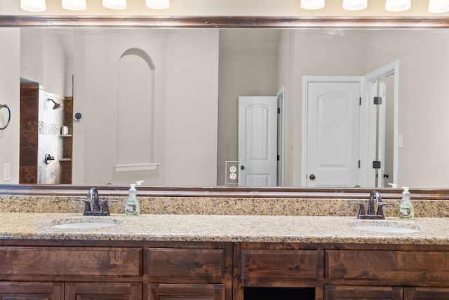 full bath featuring a sink and double vanity