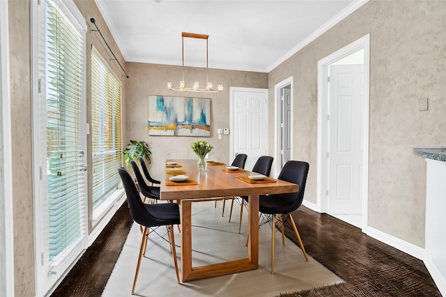 dining area featuring ornamental molding, dark wood-type flooring, baseboards, and an inviting chandelier