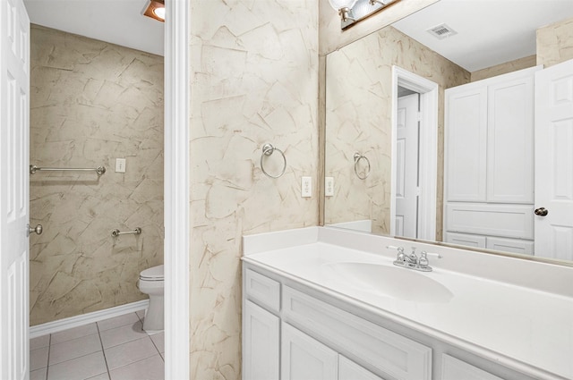 bathroom featuring toilet, vanity, tile patterned flooring, and visible vents