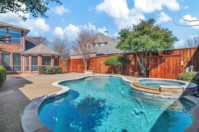 8108 Hazeltine Dr, Plano, TX 75025 - view of pool featuring a fenced backyard, a pool with connected hot tub, and a patio area