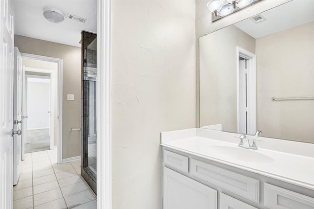 bathroom featuring visible vents, vanity, and tile patterned floors