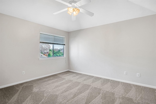 empty room featuring carpet flooring, ceiling fan, and baseboards