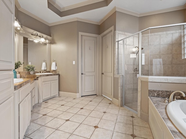 bathroom featuring ornamental molding, a garden tub, two vanities, and a shower stall