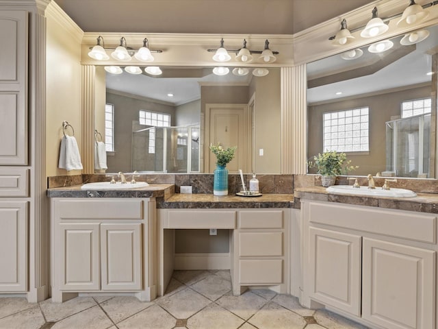 full bathroom with ornamental molding, a wealth of natural light, a sink, and a shower stall