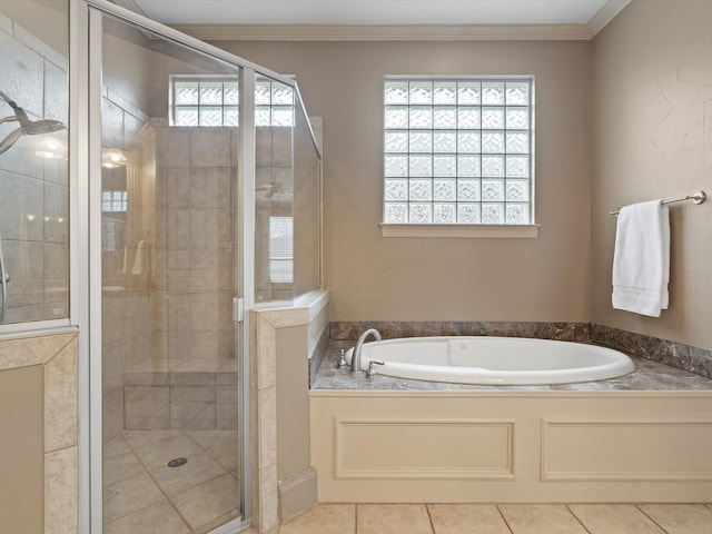 bathroom with a garden tub, tile patterned flooring, ornamental molding, and a stall shower