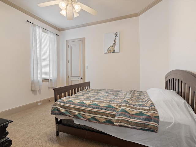 bedroom featuring a ceiling fan, carpet, crown molding, and baseboards