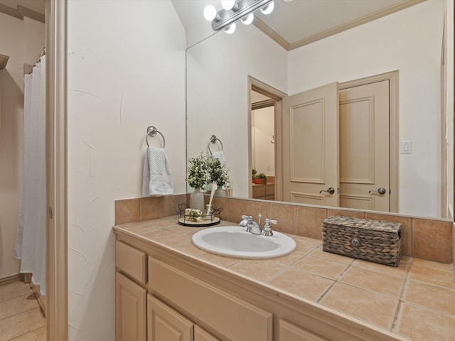 full bath featuring ornamental molding and vanity