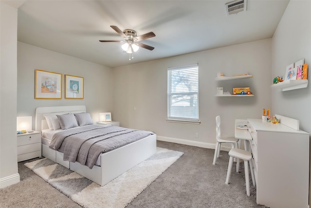 carpeted bedroom with visible vents, ceiling fan, and baseboards