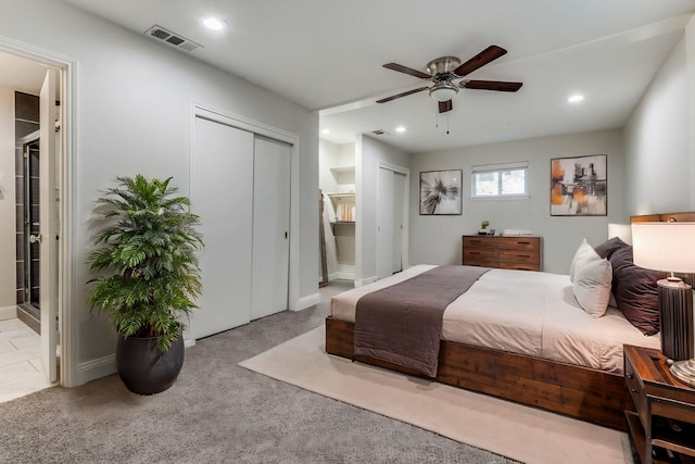 bedroom with recessed lighting, visible vents, carpet flooring, and ensuite bathroom