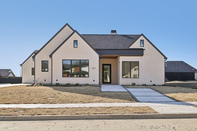 modern farmhouse with brick siding