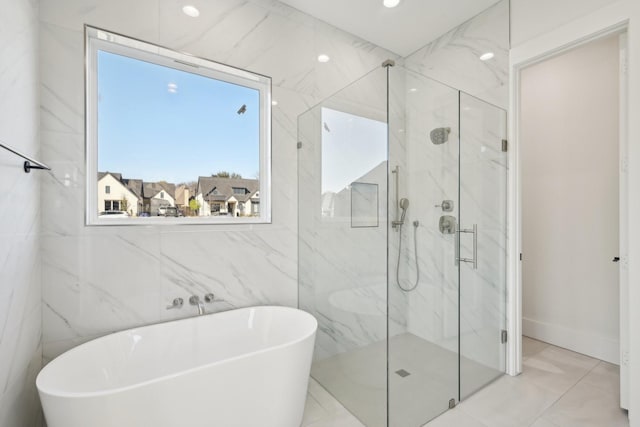 full bathroom with a soaking tub and a marble finish shower