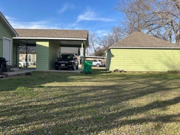 view of yard with an attached carport