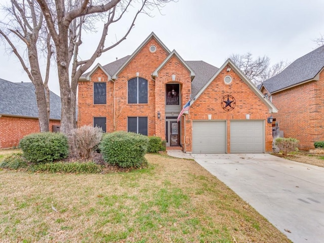 traditional-style house with driveway, brick siding, a shingled roof, an attached garage, and a front yard