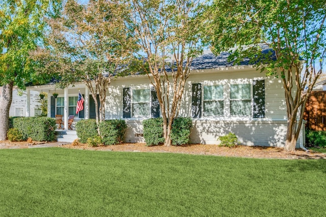 view of front of home featuring a front yard and crawl space