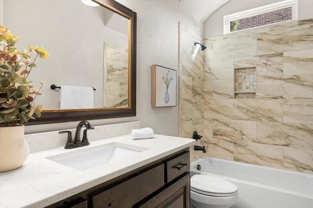 bathroom with toilet, bathing tub / shower combination, and vanity