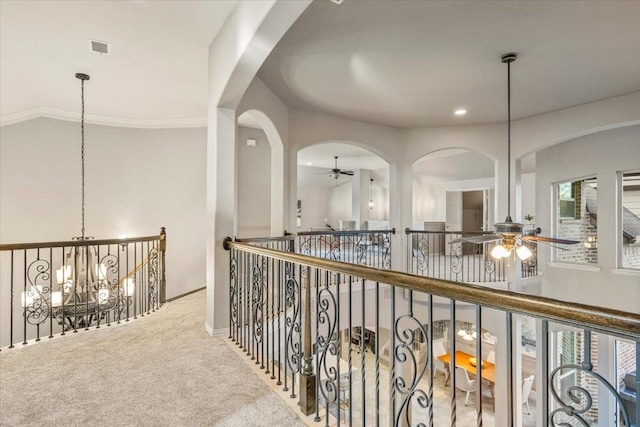 hall with recessed lighting, carpet flooring, visible vents, and a notable chandelier