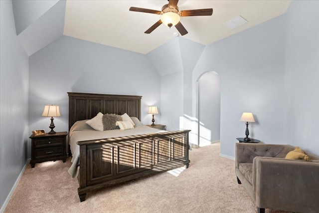 bedroom featuring light colored carpet, vaulted ceiling, baseboards, and ceiling fan