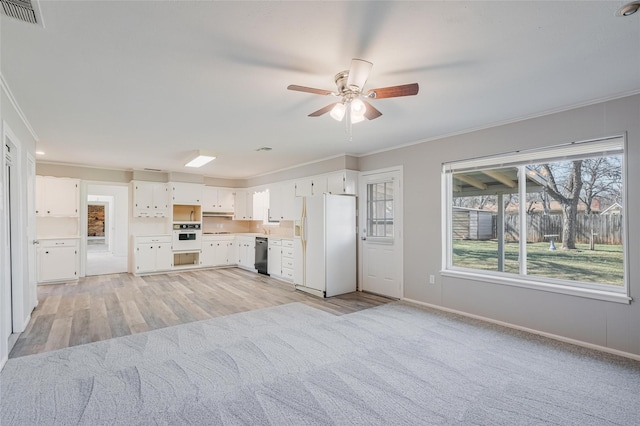 kitchen featuring white appliances, visible vents, white cabinets, ornamental molding, and light countertops