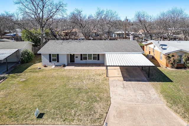 single story home with driveway, a front lawn, and a residential view