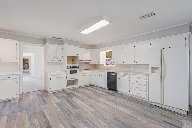 kitchen featuring ornamental molding, white appliances, visible vents, and white cabinetry