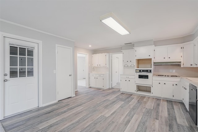 kitchen with light wood-type flooring, white cabinets, crown molding, and oven