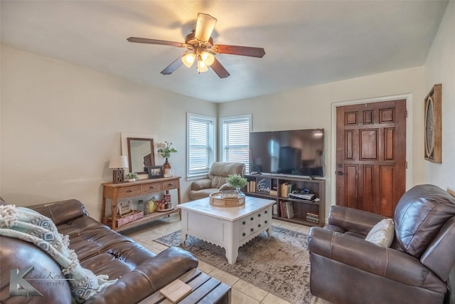 living room featuring ceiling fan and light tile patterned floors