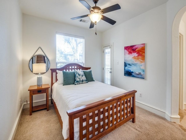 4520 Gilbert Ave, Dallas, TX 75219 - bedroom featuring arched walkways, carpet floors, baseboards, and ceiling fan