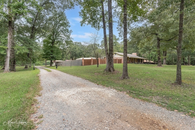 view of street with gravel driveway