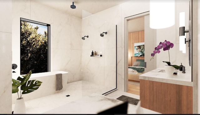 ensuite bathroom featuring a tile shower, a freestanding tub, and ensuite bath