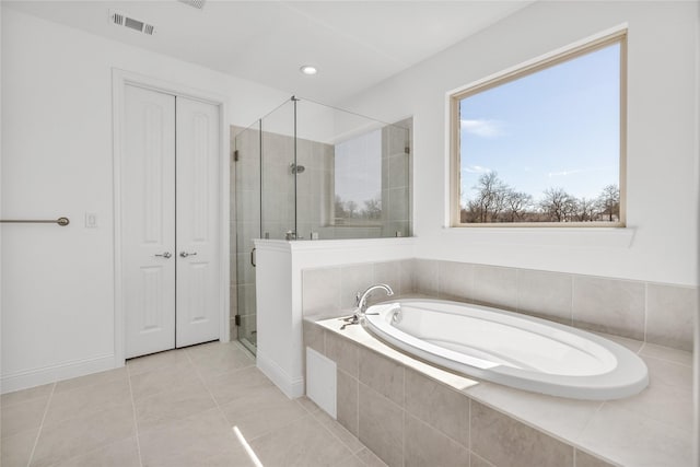 full bath featuring a stall shower, visible vents, baseboards, tile patterned flooring, and a bath