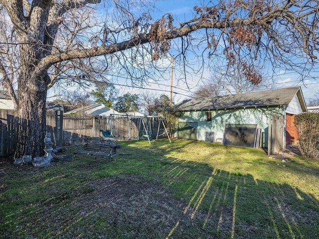 view of yard with an outdoor structure and a fenced backyard