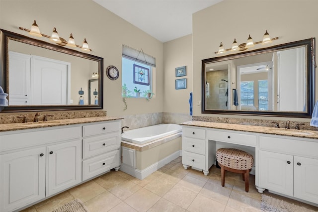 418 Navajo Trl, Gainesville, TX 76240 - full bathroom with a garden tub, a stall shower, a sink, and tile patterned floors
