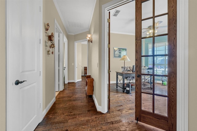418 Navajo Trl, Gainesville, TX 76240 - corridor featuring dark wood-style flooring, visible vents, baseboards, french doors, and ornamental molding