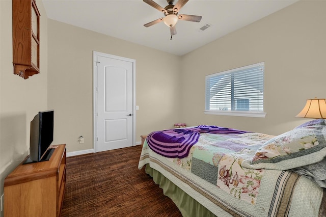 418 Navajo Trl, Gainesville, TX 76240 - bedroom with baseboards, visible vents, and ceiling fan