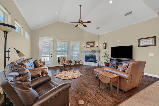 418 Navajo Trl, Gainesville, TX 76240 - living room with a fireplace, visible vents, ornamental molding, high vaulted ceiling, and baseboards