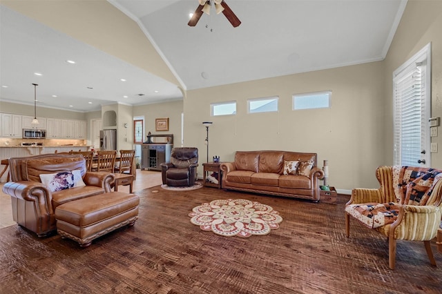 418 Navajo Trl, Gainesville, TX 76240 - living area with baseboards, lofted ceiling, ceiling fan, wood finished floors, and crown molding