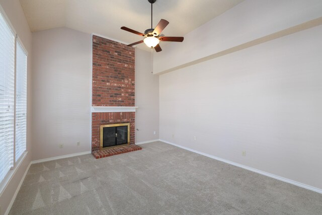 unfurnished living room featuring light carpet, baseboards, ceiling fan, vaulted ceiling, and a brick fireplace