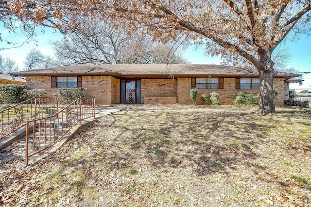 ranch-style house with brick siding