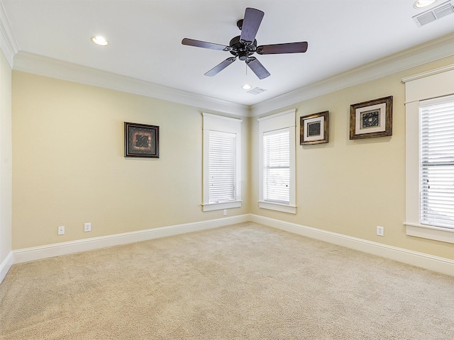 unfurnished room featuring ornamental molding, carpet, and visible vents