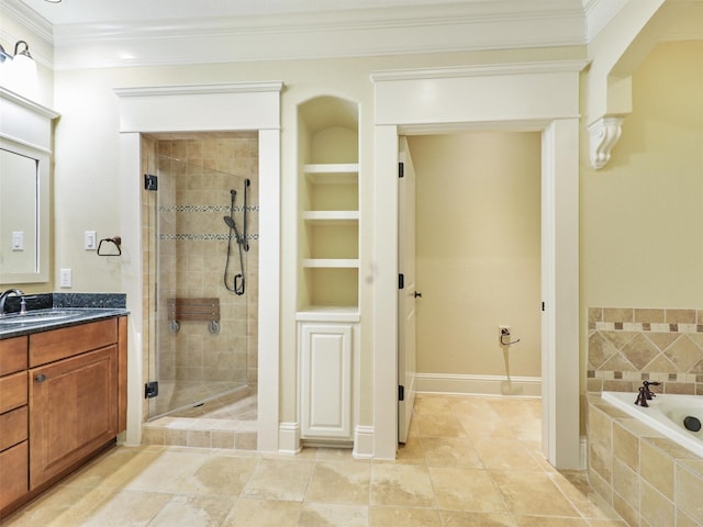 bathroom featuring a stall shower, tiled tub, ornamental molding, and vanity