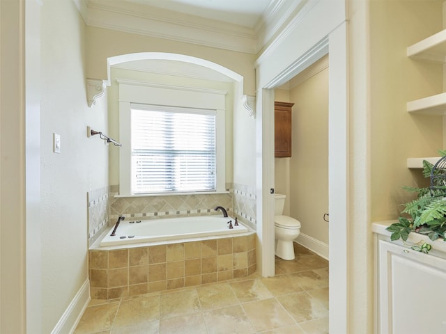 bathroom featuring ornamental molding, tile patterned flooring, toilet, and a bath