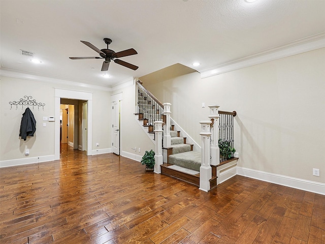 interior space with visible vents, crown molding, stairway, and hardwood / wood-style floors