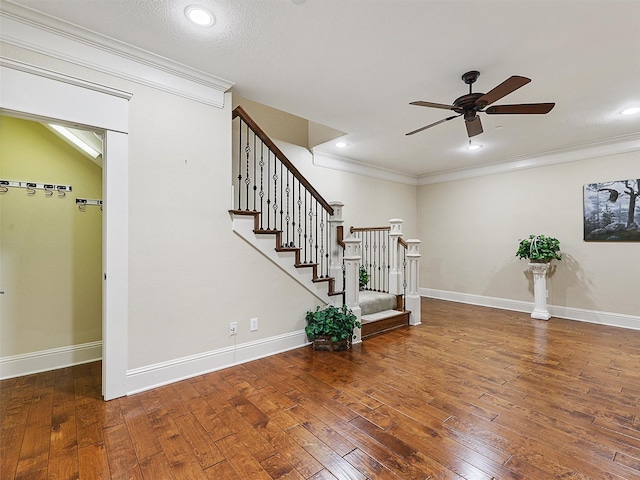 staircase featuring ornamental molding, recessed lighting, hardwood / wood-style flooring, and baseboards