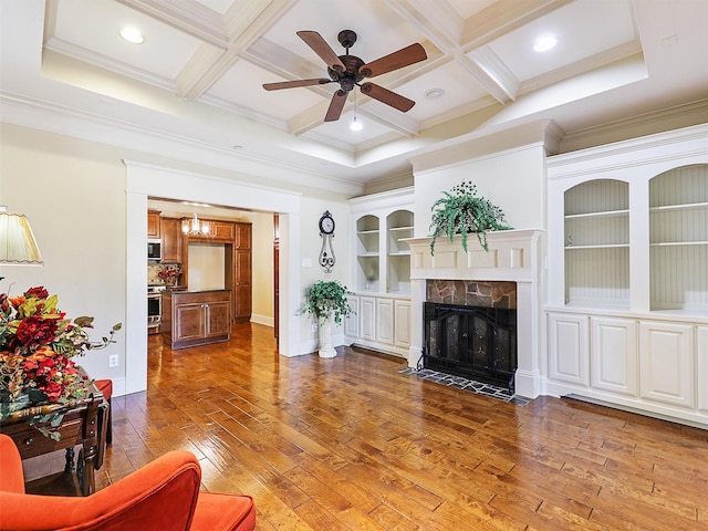 living area featuring a fireplace with flush hearth, coffered ceiling, beamed ceiling, and hardwood / wood-style flooring