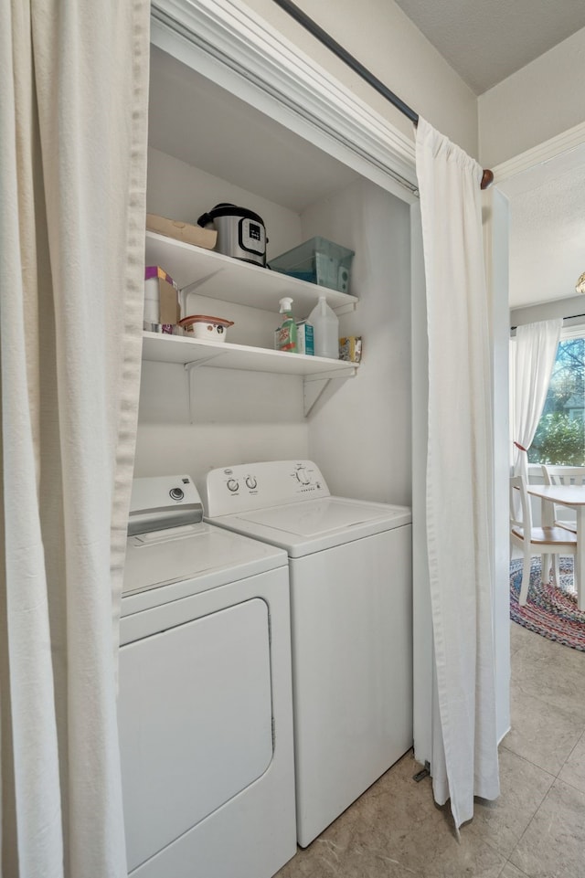 laundry room with laundry area and washer and clothes dryer