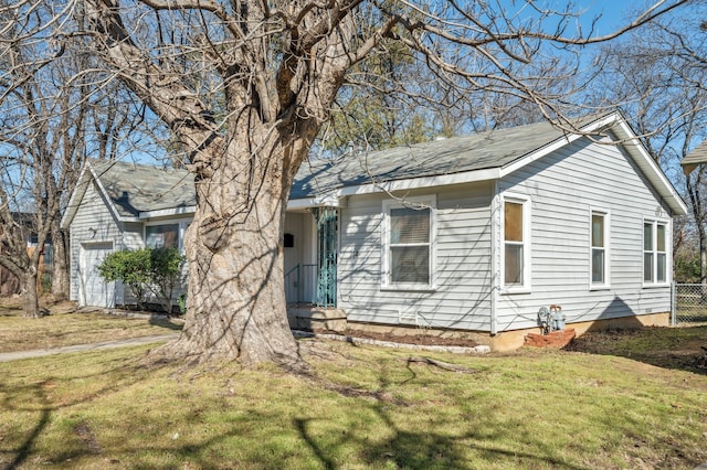 view of front of home with an attached garage and a front yard