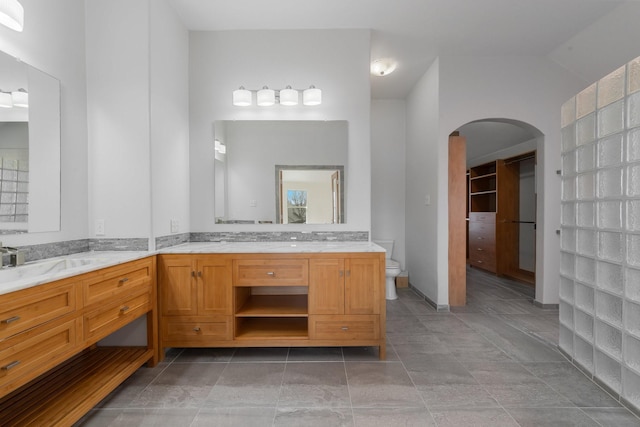 full bath featuring toilet and vanity