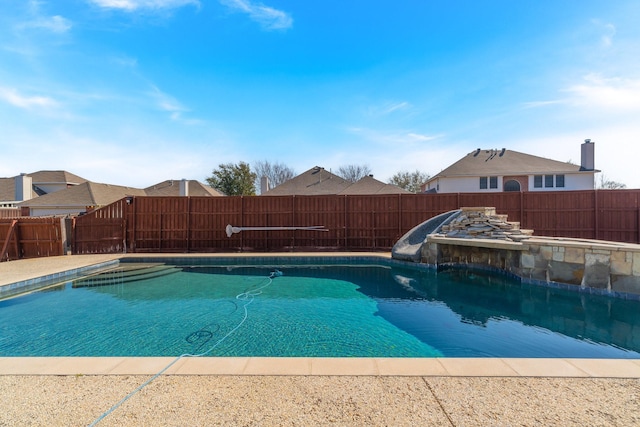 view of swimming pool with a fenced in pool and a fenced backyard