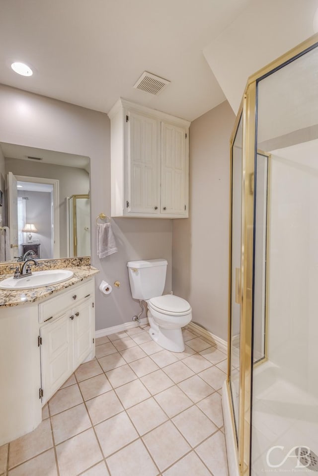 bathroom featuring visible vents, toilet, a shower stall, vanity, and tile patterned flooring