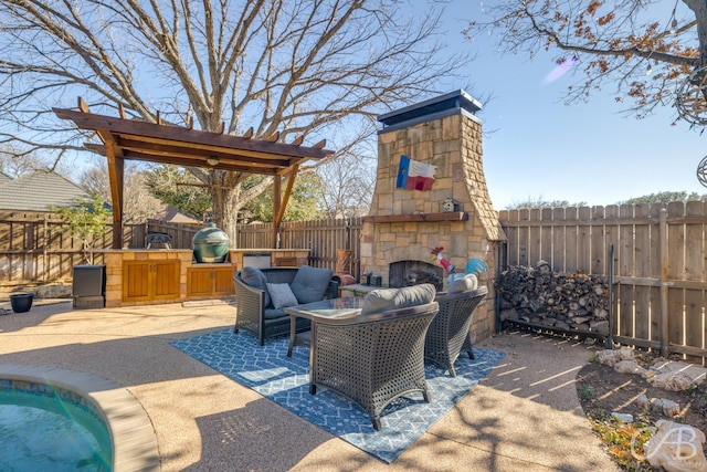 view of patio / terrace with an outdoor stone fireplace, grilling area, and a fenced backyard